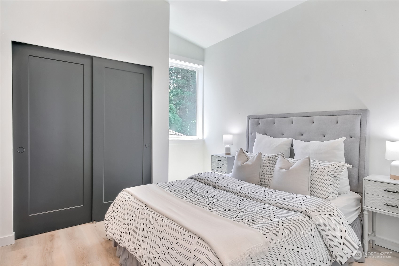 6839 35th Avenue Northeast, Unit A Seattle, WA 98115 - Photo 29 of 39 a bedroom with a bed and a window