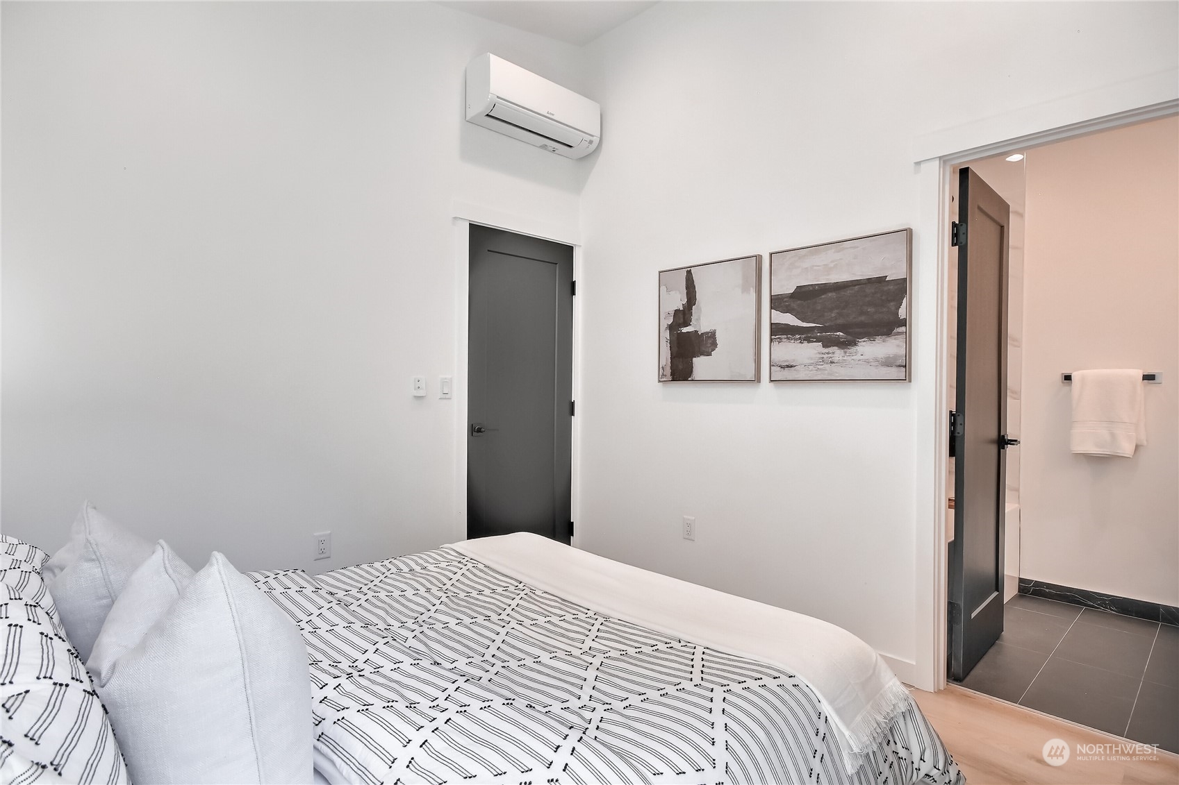 6839 35th Avenue Northeast, Unit A Seattle, WA 98115 - Photo 30 of 39 a bedroom with a bed and painting on the wall