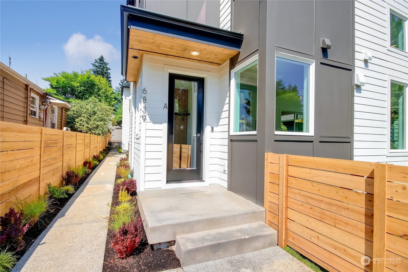 6839 35th Avenue Northeast, Unit A Seattle, WA 98115 - Photo 3 of 39 a view of a house with a balcony
