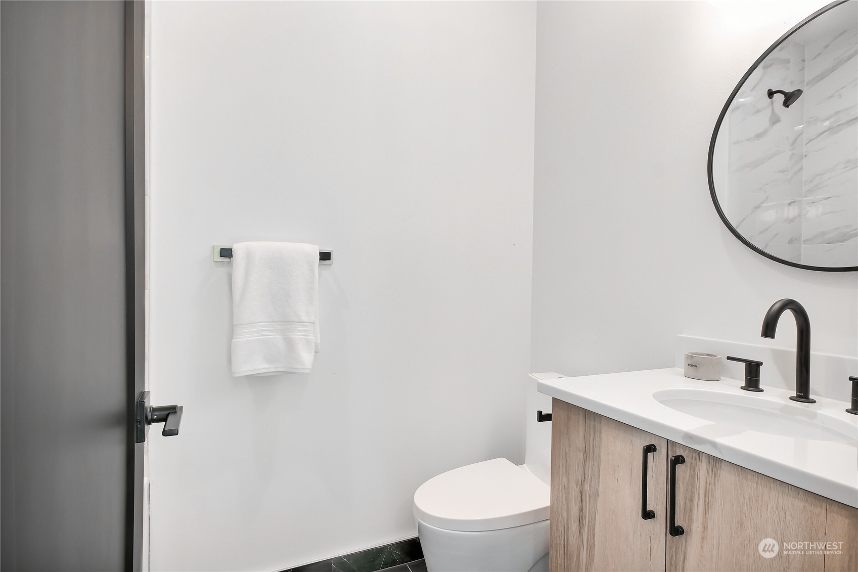 6839 35th Avenue Northeast, Unit A Seattle, WA 98115 - Photo 31 of 39 a bathroom with a toilet sink and mirror