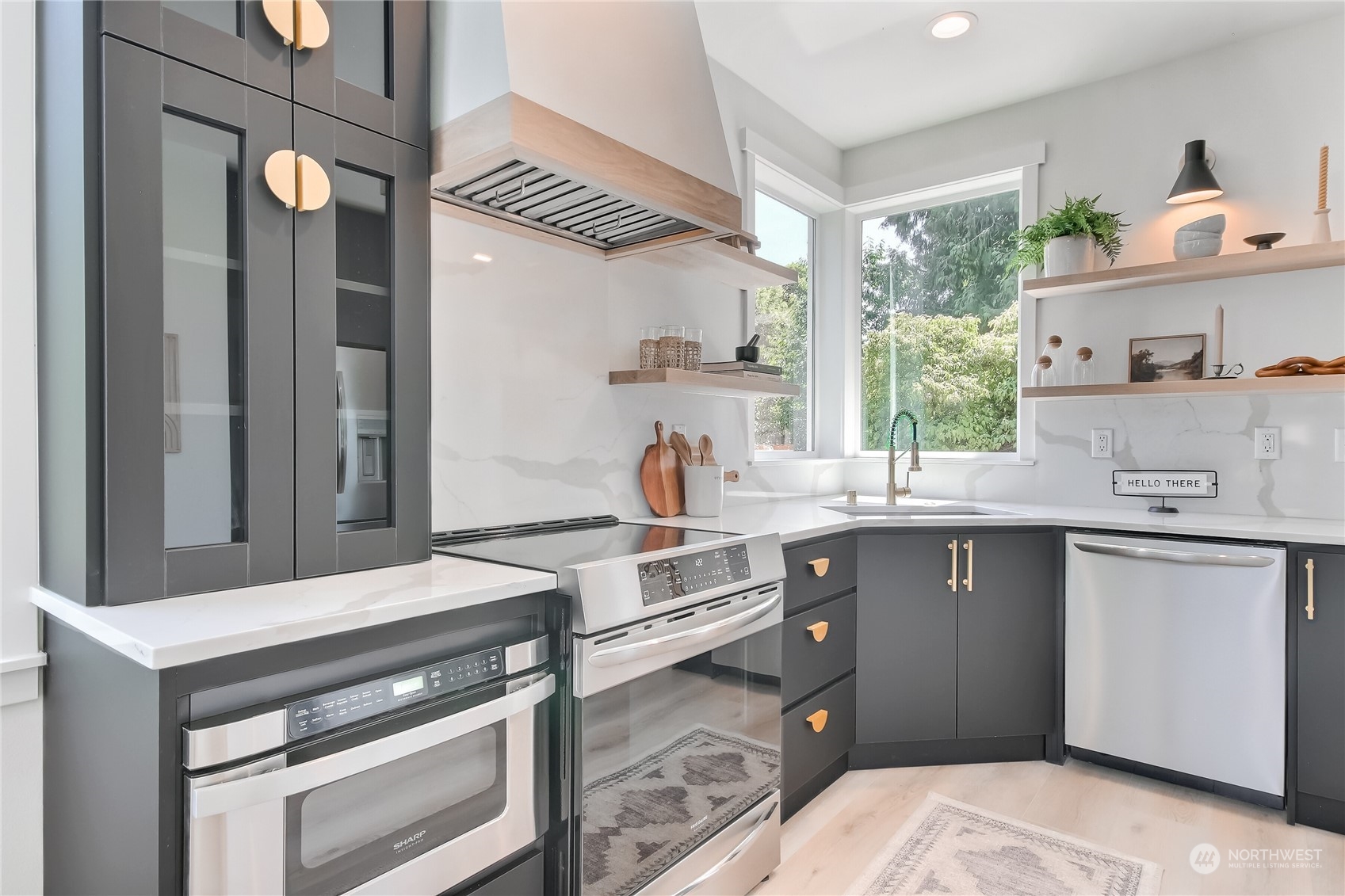 6839 35th Avenue Northeast, Unit A Seattle, WA 98115 - Photo 7 of 39 a kitchen with a stove and a sink
