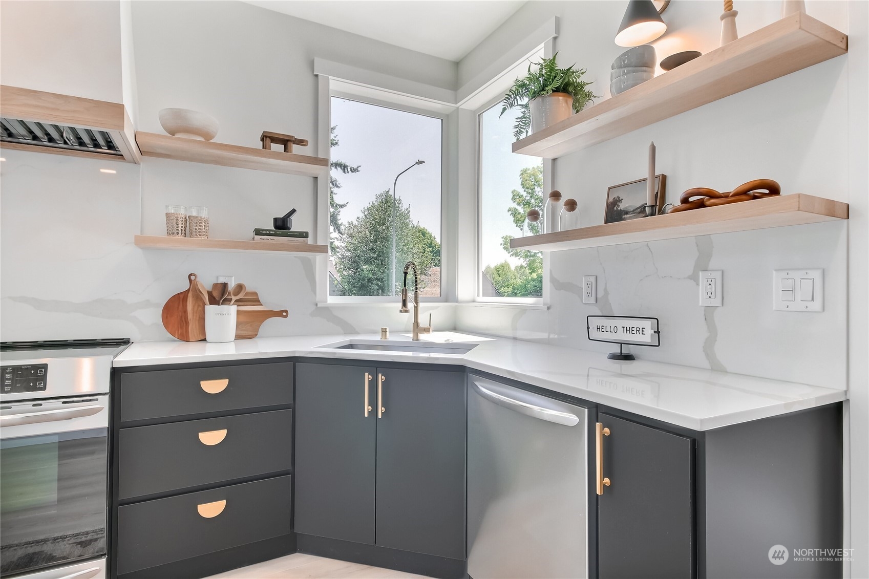 6839 35th Avenue Northeast, Unit A Seattle, WA 98115 - Photo 8 of 39 a kitchen with a sink a counter space and cabinets