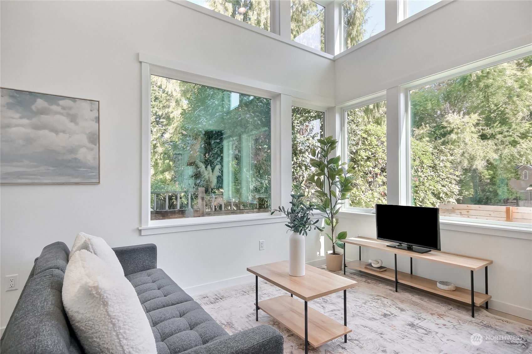 6839 35th Avenue Northeast, Unit A Seattle, WA 98115 - Photo 10 of 39 a living room with furniture and a flat screen tv