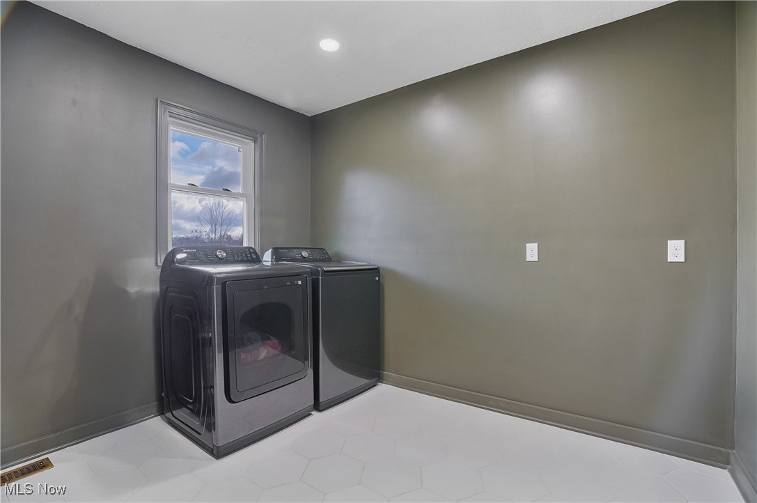 9278 Bryant Road Windham, OH 44288 - Photo 21 of 47 Washroom featuring washer and dryer, light tile patterned floors, and recessed lighting