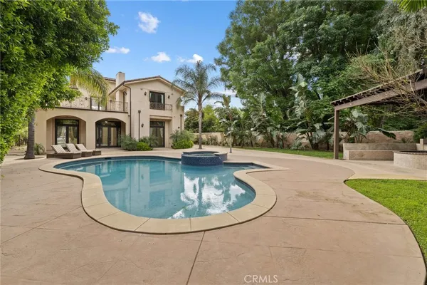a view of a house with a swimming pool