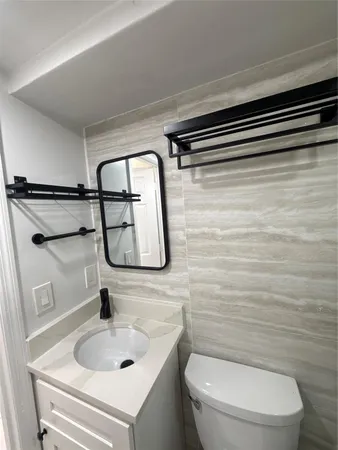 a bathroom with a toilet and a sink