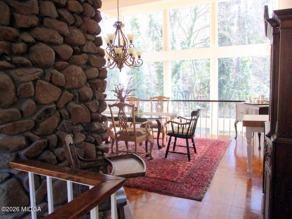 1121 South Jackson Springs Road Macon, GA 31211 - Photo 5 of 29 a view of a dining room with furniture and a window