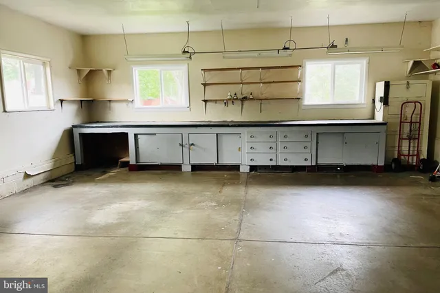 a view of an empty room with a large window