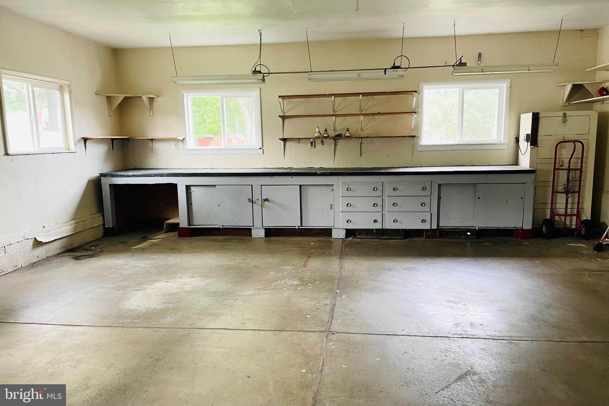 7490 Race Road Hanover, MD 21076 - Photo 17 of 23 a kitchen with cabinets and window