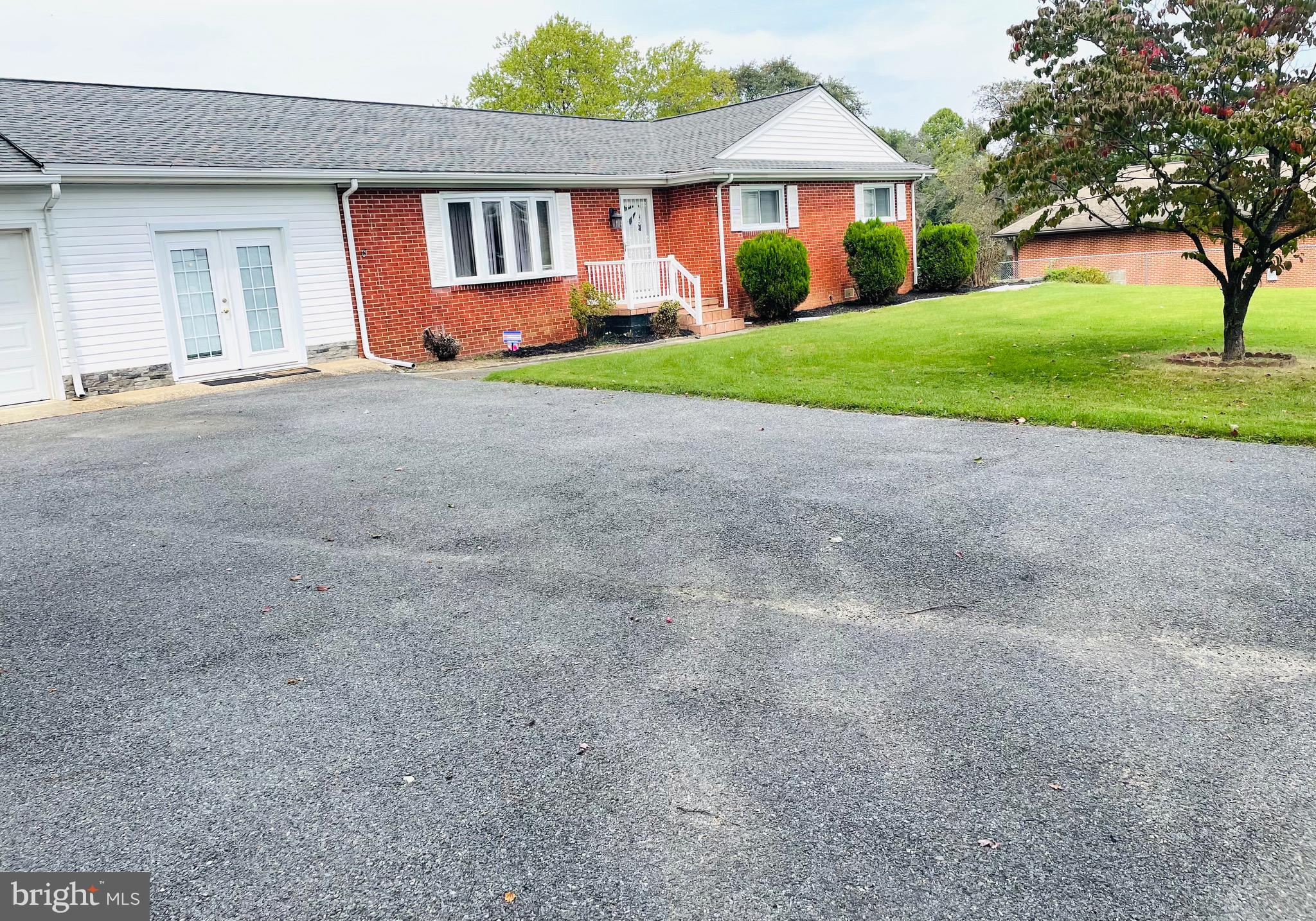 7490 Race Road Hanover, MD 21076 - Photo 2 of 23 a front view of house with yard and green space