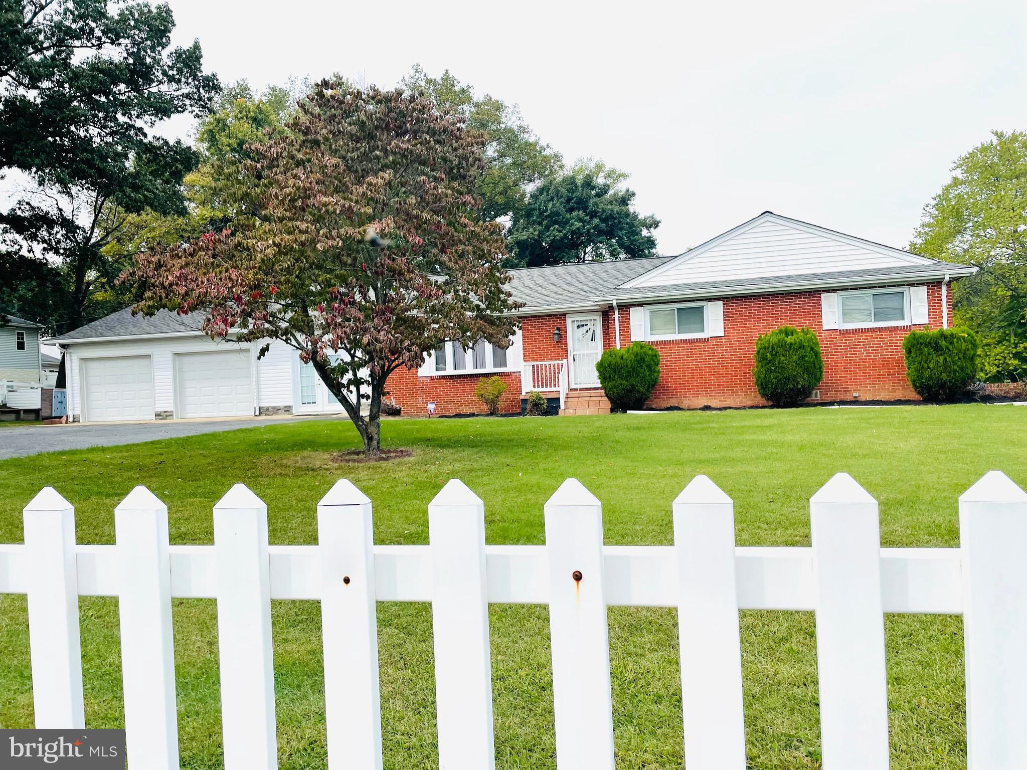 7490 Race Road Hanover, MD 21076 - Photo 3 of 23 a front view of house with yard and green space