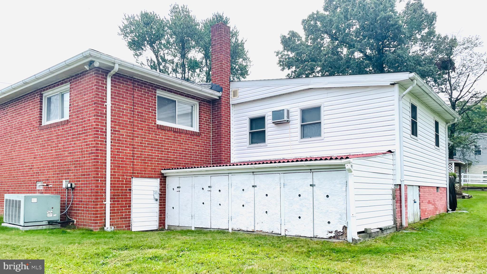 7490 Race Road Hanover, MD 21076 - Photo 4 of 23 a front view of a house with garden