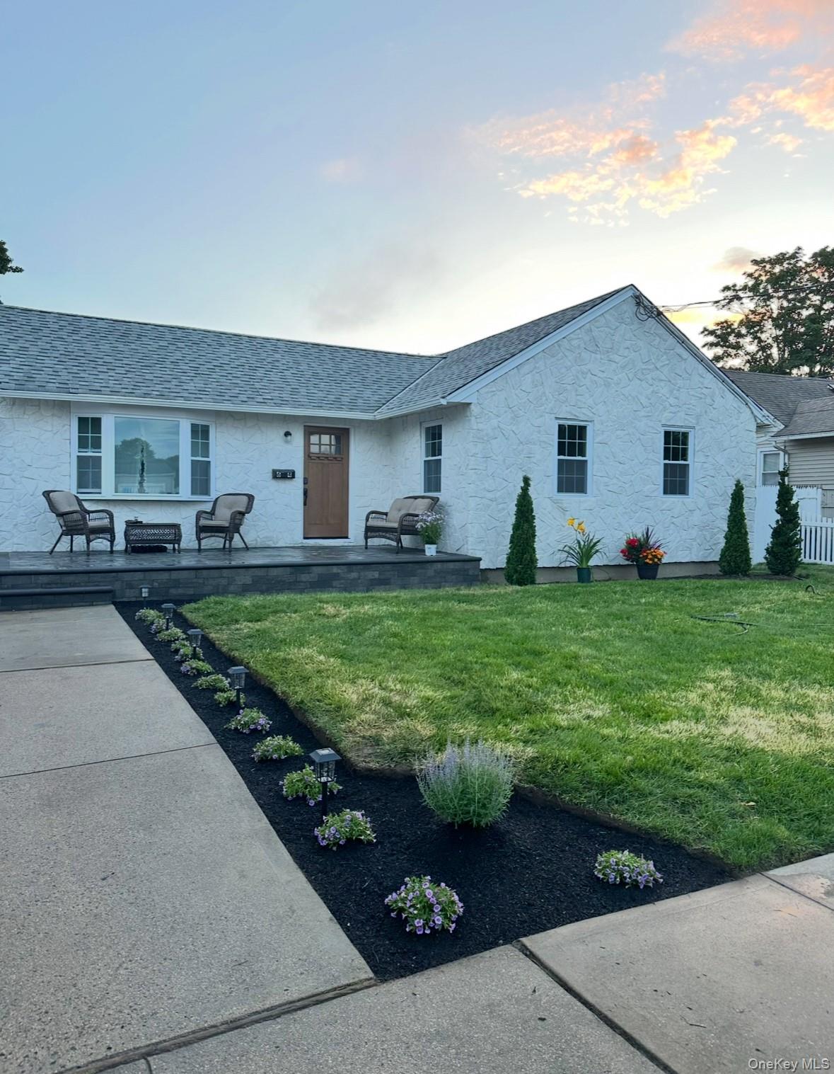a house view with a garden space