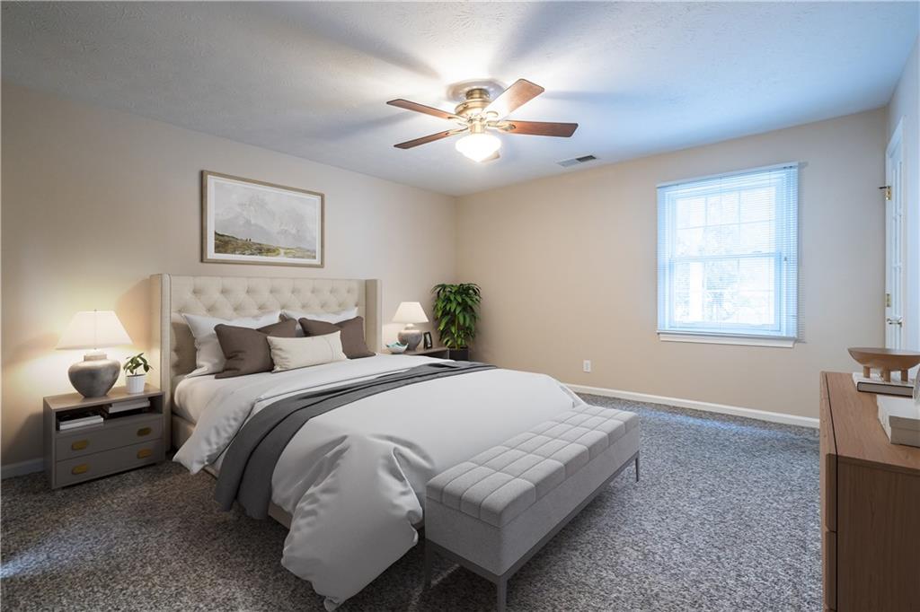 6700 Roswell Road, Unit 1C Sandy Springs, GA 30328 - Photo 17 of 41 a bedroom with a large bed and a chandelier