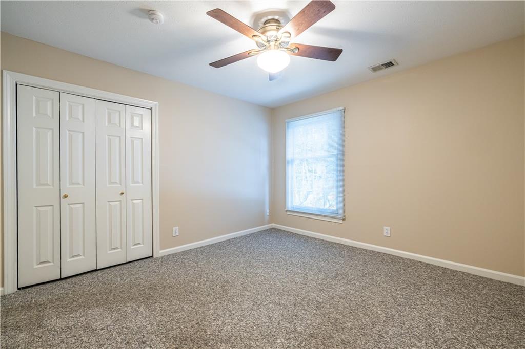 6700 Roswell Road, Unit 1C Sandy Springs, GA 30328 - Photo 22 of 41 a view of an empty room with a window