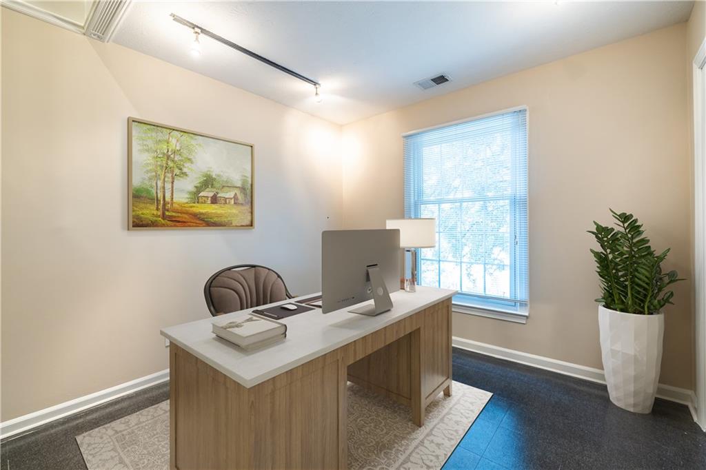6700 Roswell Road, Unit 1C Sandy Springs, GA 30328 - Photo 25 of 41 a kitchen with a stove a sink and a window