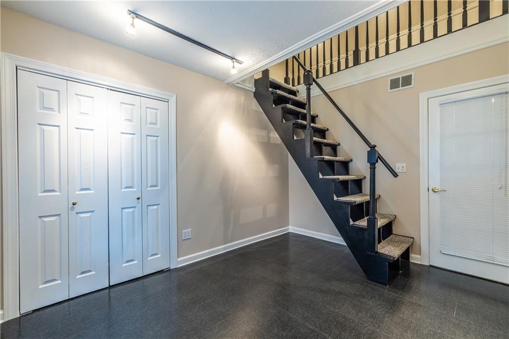 6700 Roswell Road, Unit 1C Sandy Springs, GA 30328 - Photo 27 of 41 a view of entryway with wooden floor