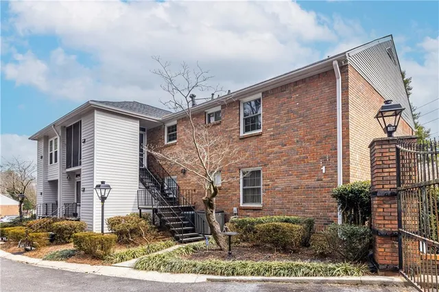 a house with a tree in front of it