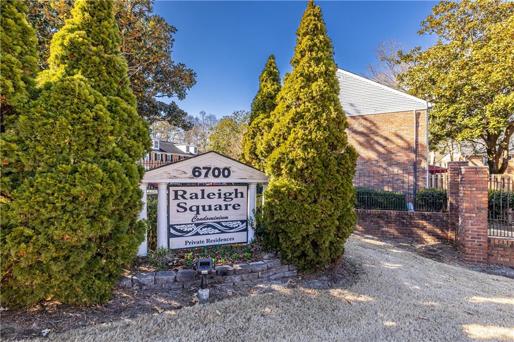 6700 Roswell Road, Unit 1C Sandy Springs, GA 30328 - Photo 41 of 41 a sign that is sitting on a brick wall