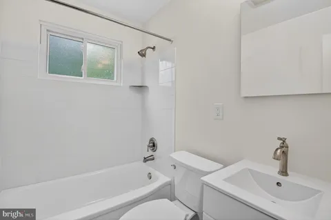 a bathroom with a sink and a bathtub