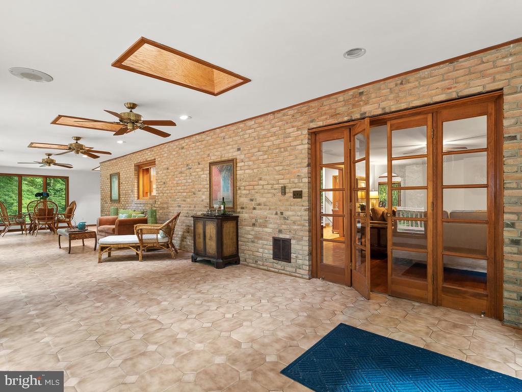 22305 Fitzgerald Drive Laytonsville, MD 20882 - Photo 25 of 109 Lounge/Sunroom off Kitchen 45' x 12'