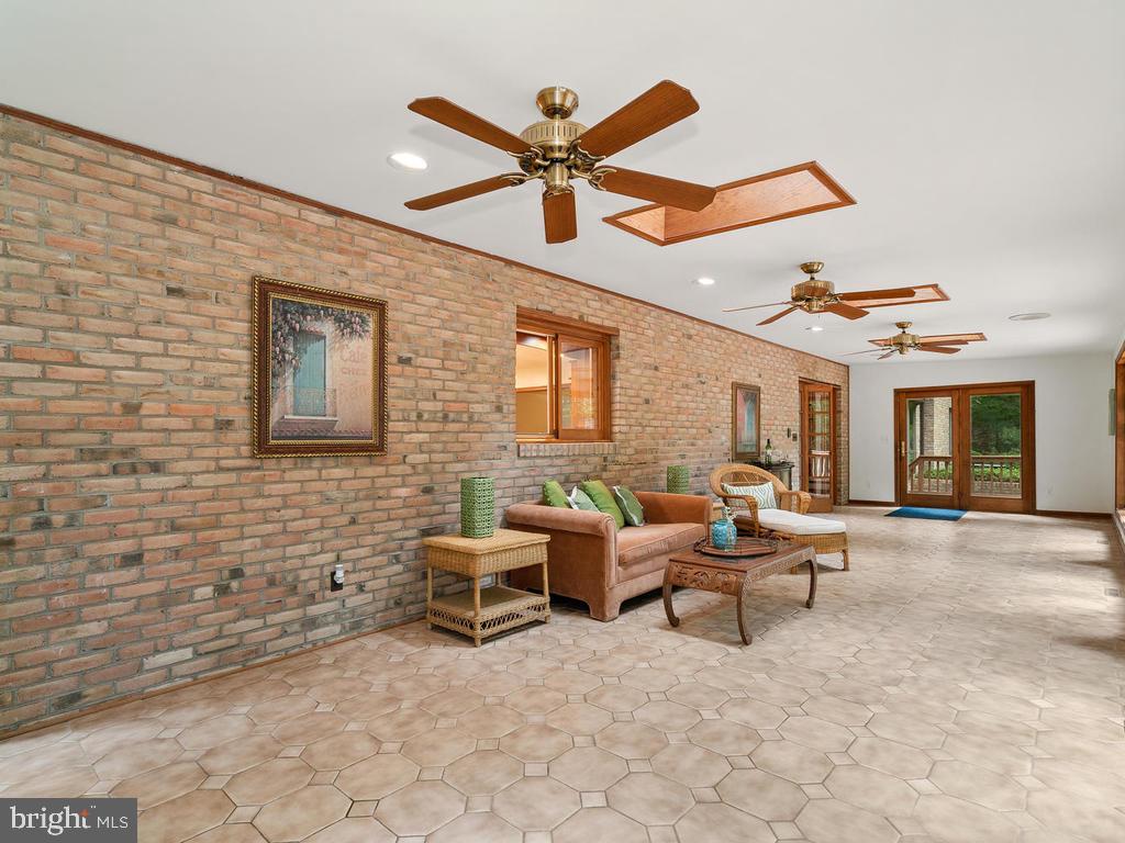 22305 Fitzgerald Drive Laytonsville, MD 20882 - Photo 27 of 109 Lounge/Sunroom 45' x 12'