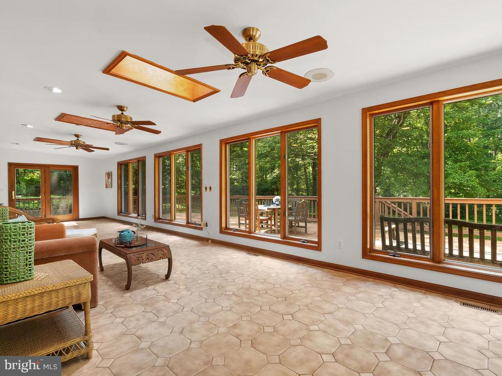 22305 Fitzgerald Drive Laytonsville, MD 20882 - Photo 29 of 109 Lounge/Sunroom 45' x 12'
