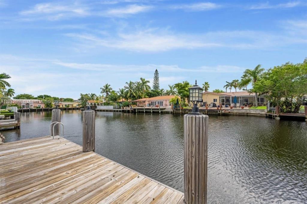 2810 Northeast 60th Street Fort Lauderdale, FL 33308 - Photo 3 of 22 a view of a lake with boats and trees in the background