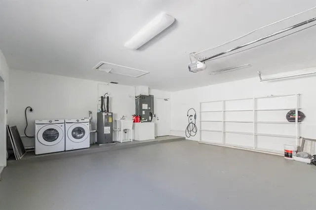 a view of a livingroom with wooden floor and a ceiling fan