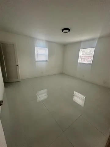 en empty room with windows