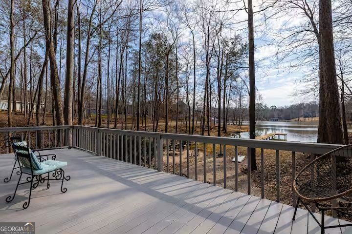68 Franklin Road Eatonton, GA 31024 - Photo 4 of 28 a view of balcony with wooden floor and outdoor seating