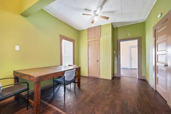 a view of a room with furniture and wooden floor