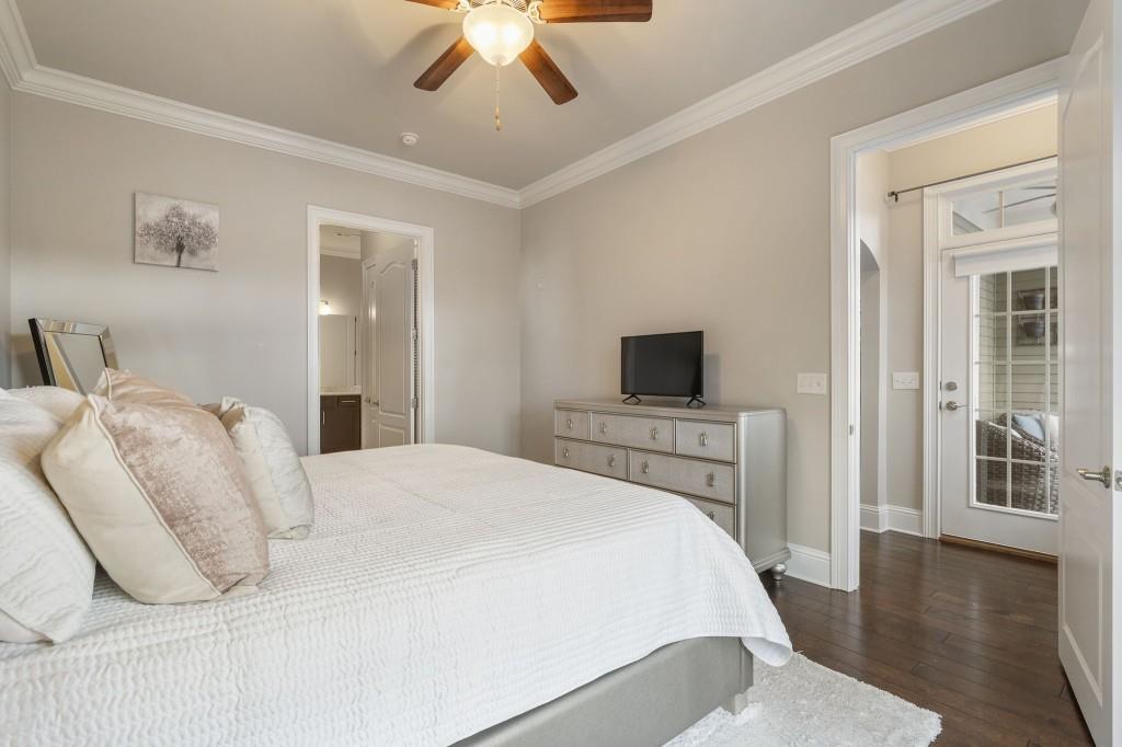 2300 Peachford Road, Unit 4403 Atlanta, GA 30338 - Photo 12 of 27 a bedroom with a large bed and a tv