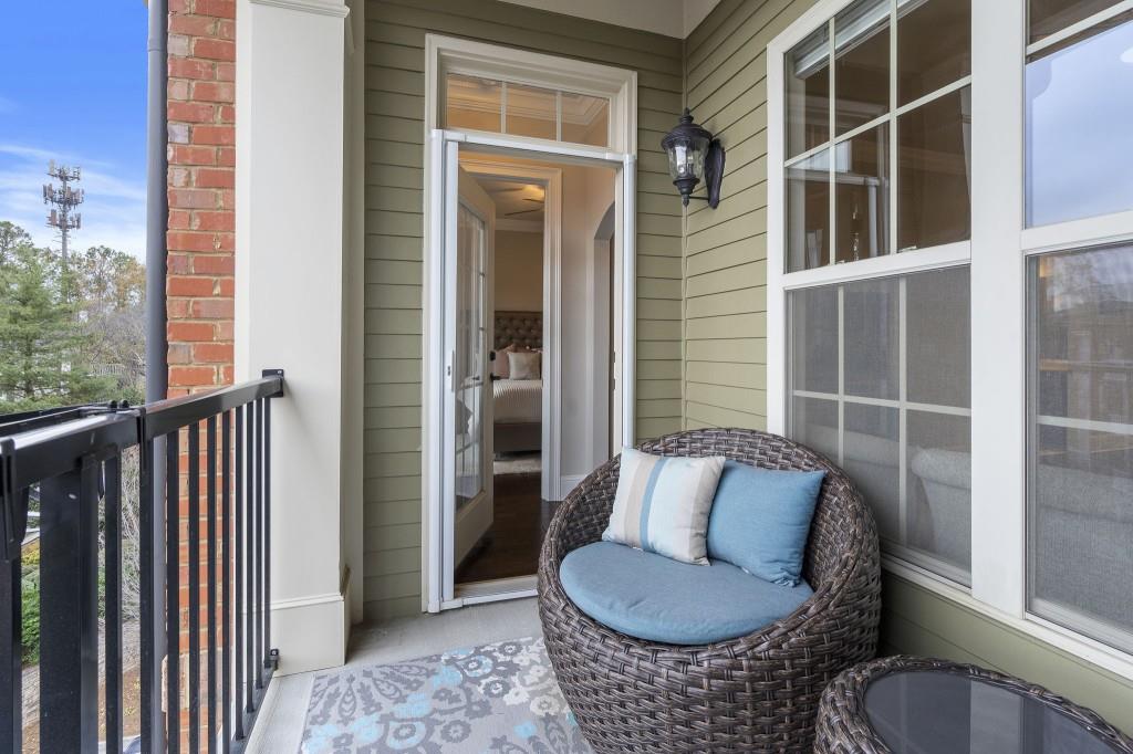 2300 Peachford Road, Unit 4403 Atlanta, GA 30338 - Photo 17 of 27 a balcony with furniture and a potted plant