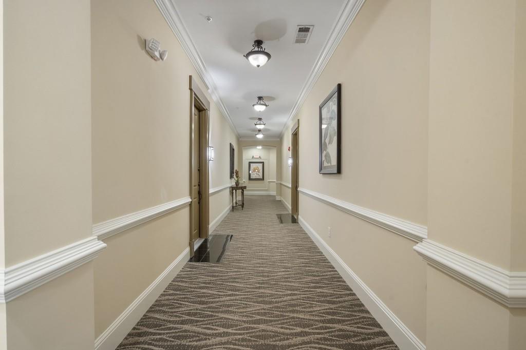 2300 Peachford Road, Unit 4403 Atlanta, GA 30338 - Photo 19 of 27 a view of a hallway with wooden floor and staircase