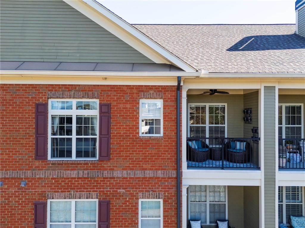 2300 Peachford Road, Unit 4403 Atlanta, GA 30338 - Photo 22 of 27 a view of a brick building with large windows