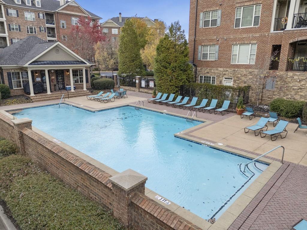 2300 Peachford Road, Unit 4403 Atlanta, GA 30338 - Photo 23 of 27 a view of a house with pool and chairs