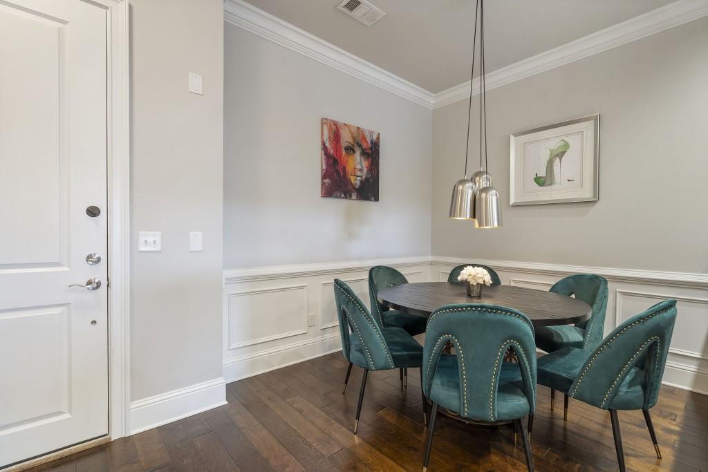 2300 Peachford Road, Unit 4403 Atlanta, GA 30338 - Photo 4 of 27 a view of a dining room with furniture and wooden floor