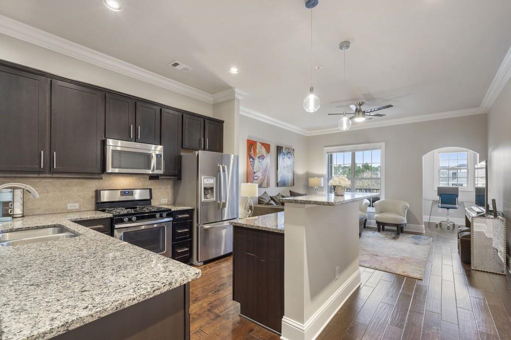 2300 Peachford Road, Unit 4403 Atlanta, GA 30338 - Photo 8 of 27 a kitchen with a sink stove and refrigerator