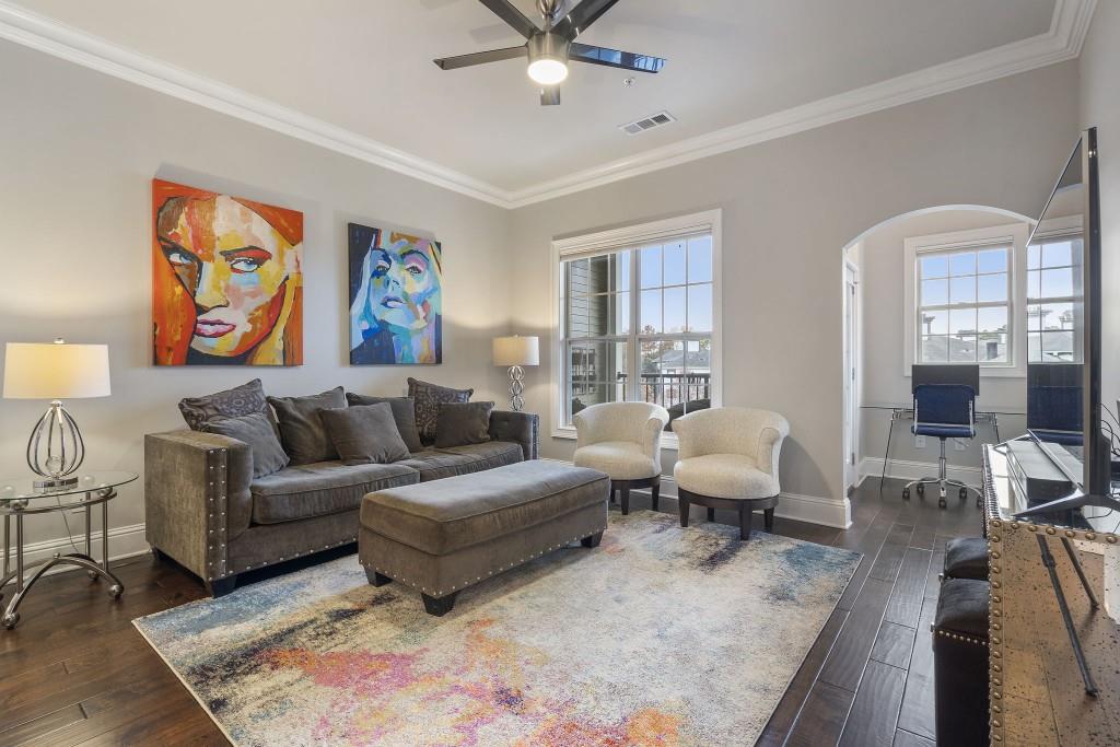 2300 Peachford Road, Unit 4403 Atlanta, GA 30338 - Photo 9 of 27 a living room with furniture and a large window