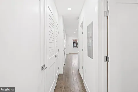 a view of a hallway with a white walls