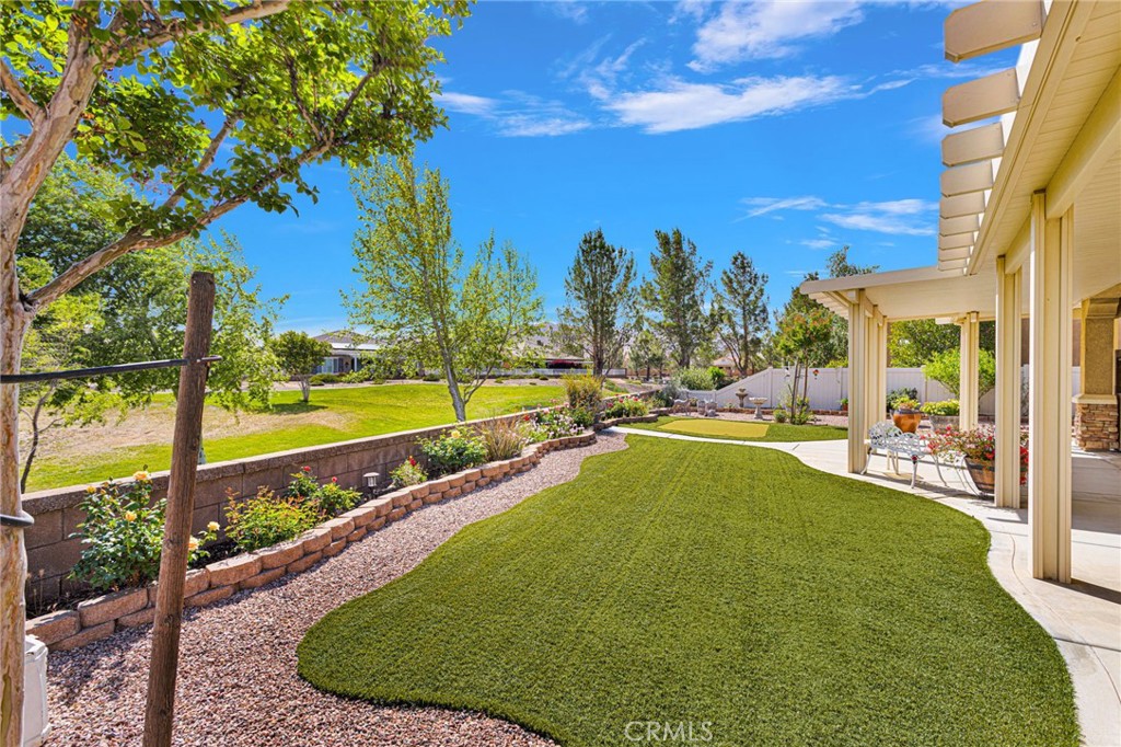 10429 Lanigan Road Apple Valley, CA 92308 - Photo 11 of 41 a view of a swimming pool with an outdoor seating and a yard