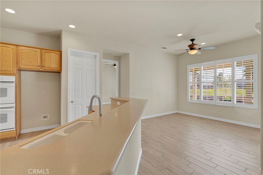 10429 Lanigan Road Apple Valley, CA 92308 - Photo 14 of 41 a bathroom with a granite countertop sink a mirror and shower
