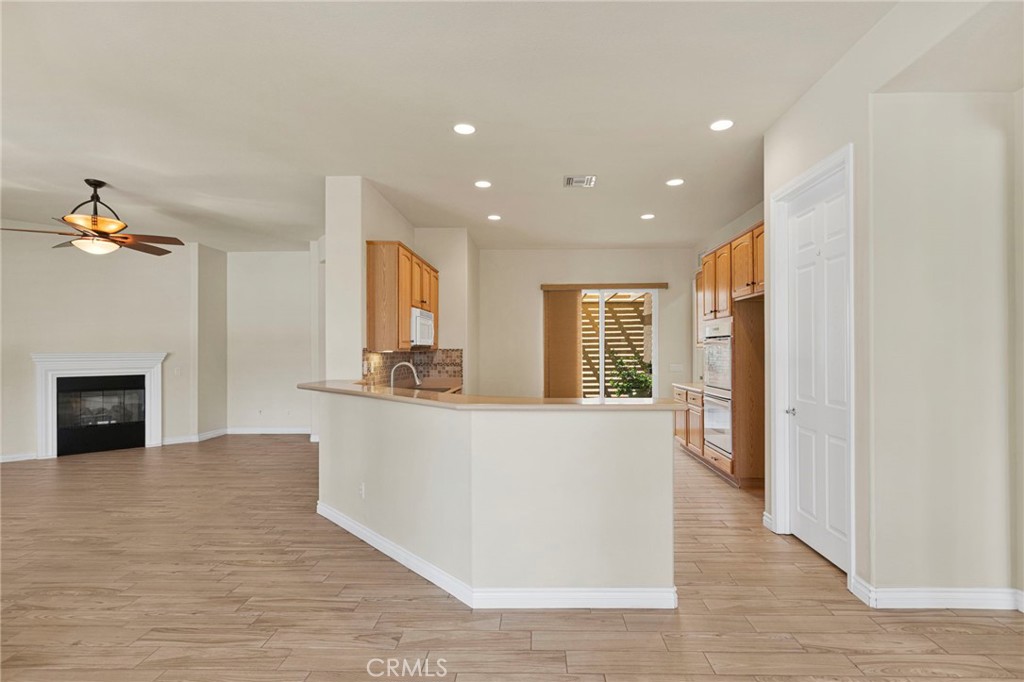 10429 Lanigan Road Apple Valley, CA 92308 - Photo 16 of 41 a living room with furniture and a fireplace