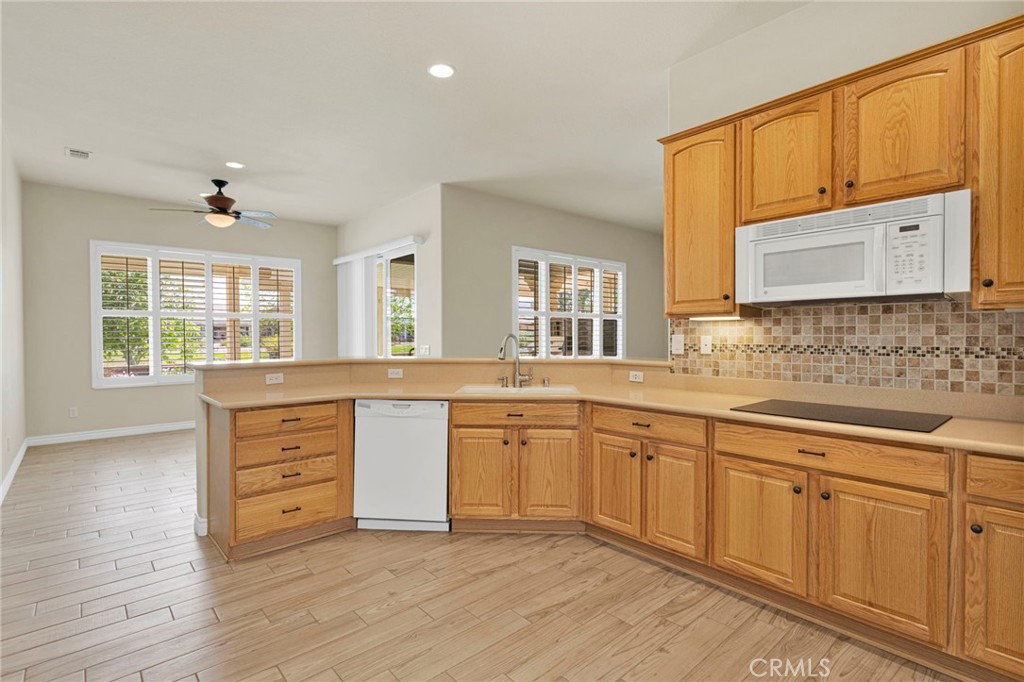 10429 Lanigan Road Apple Valley, CA 92308 - Photo 20 of 41 a spacious bathroom with a granite countertop double vanity sink a mirror and a bathtub