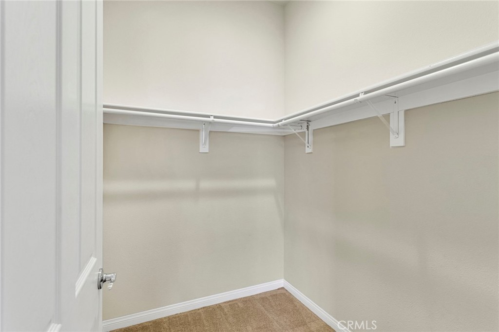 10429 Lanigan Road Apple Valley, CA 92308 - Photo 33 of 41 a view of an empty walk in closet