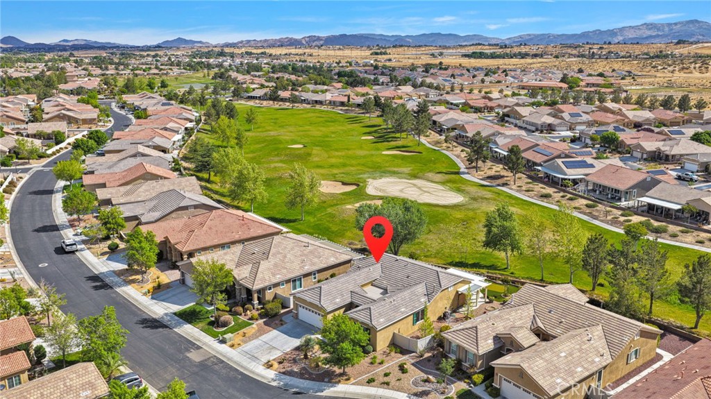 10429 Lanigan Road Apple Valley, CA 92308 - Photo 35 of 41 an aerial view of residential houses with outdoor space and trees