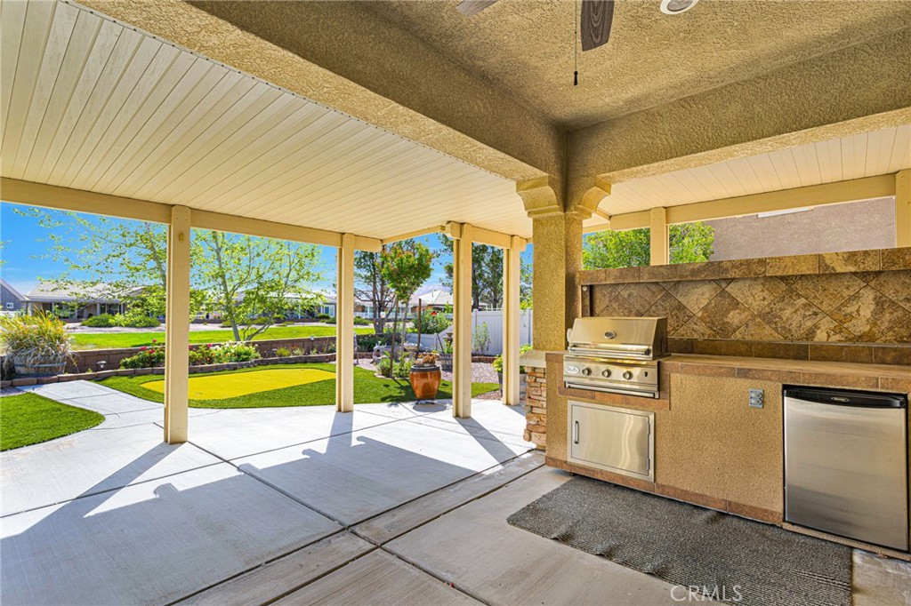 10429 Lanigan Road Apple Valley, CA 92308 - Photo 7 of 41 a kitchen with stainless steel appliances granite countertop a stove and a refrigerator