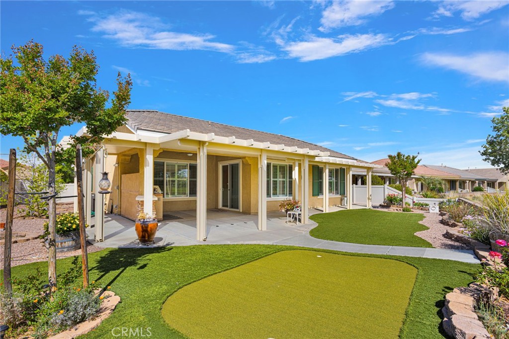 10429 Lanigan Road Apple Valley, CA 92308 - Photo 10 of 41 a view of a house with swimming pool and sitting area
