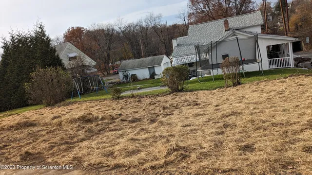 a view of a backyard of a house